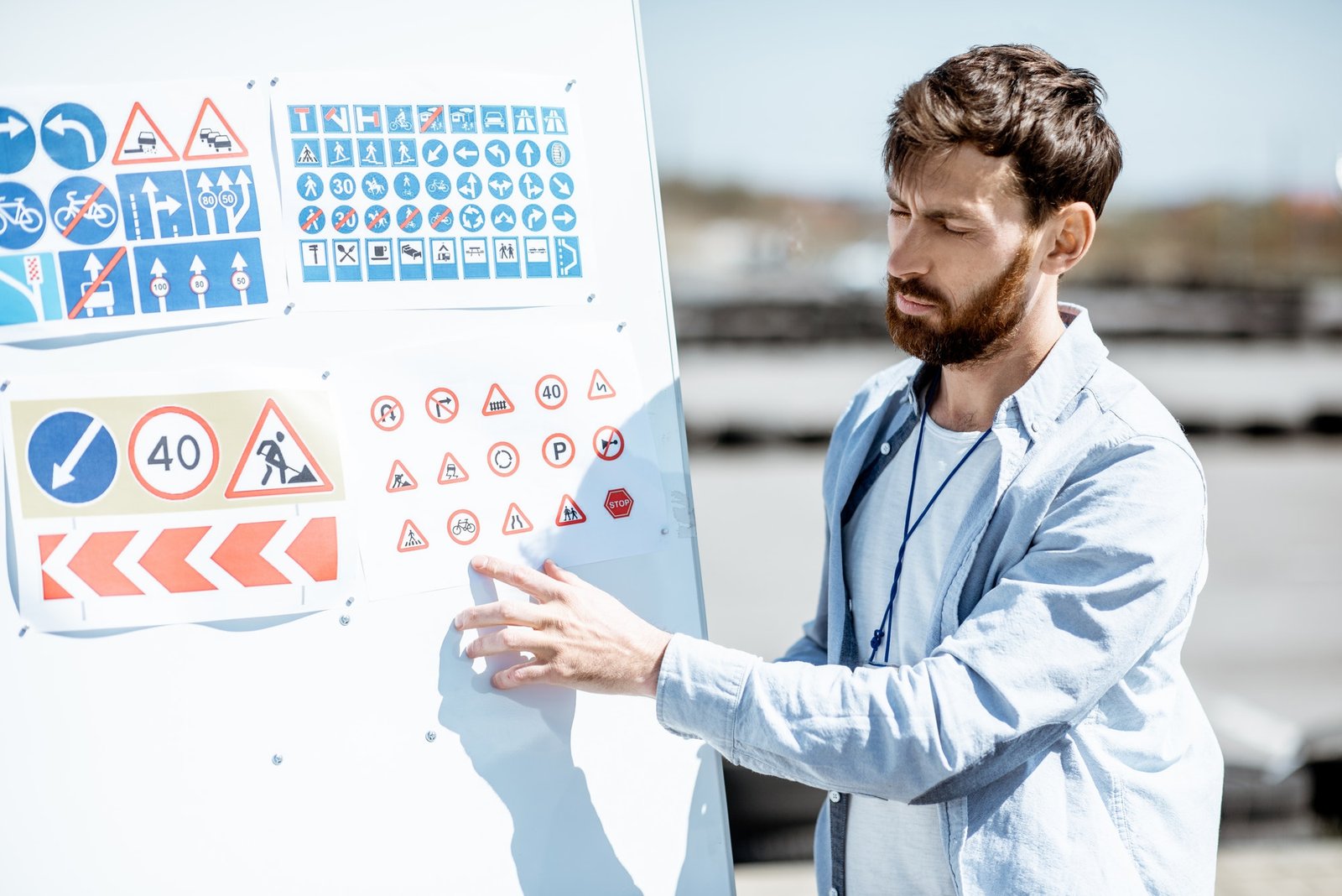 driver-instructor-showing-traffiic-signs.jpg